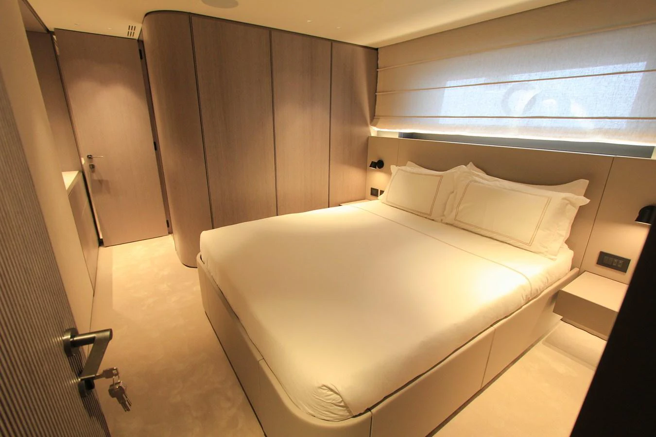 A luxurious stateroom featuring a large, comfortable bed and elegant, modern decor. aboard OASIS 34M BO212 Yacht for Sale