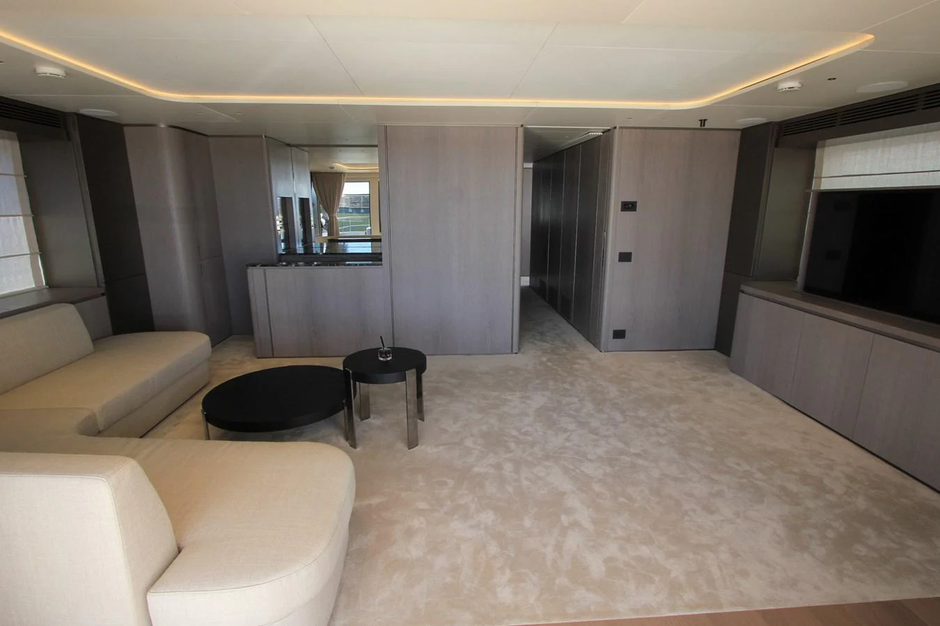The yacht's interior features a spacious and modern living area with elegant furnishings and ample natural light. aboard OASIS 34M BO212 Yacht for Sale