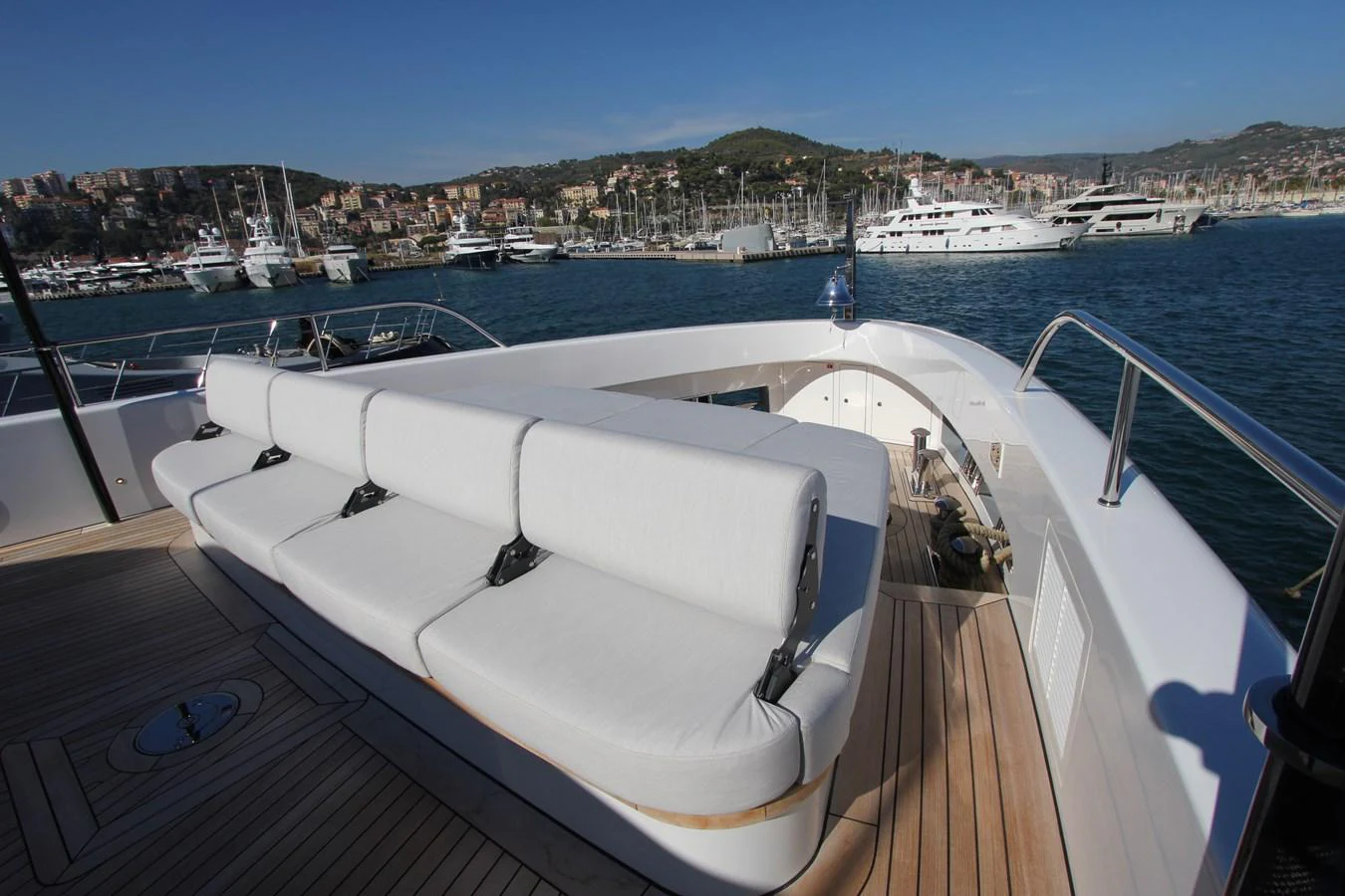 The aft deck features a spacious seating area with a stunning view of the marina. aboard OASIS 34M BO212 Yacht for Sale
