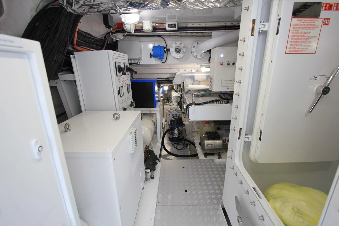The image showcases the well-organized and clean engine room of the yacht. aboard OASIS 34M BO212 Yacht for Sale