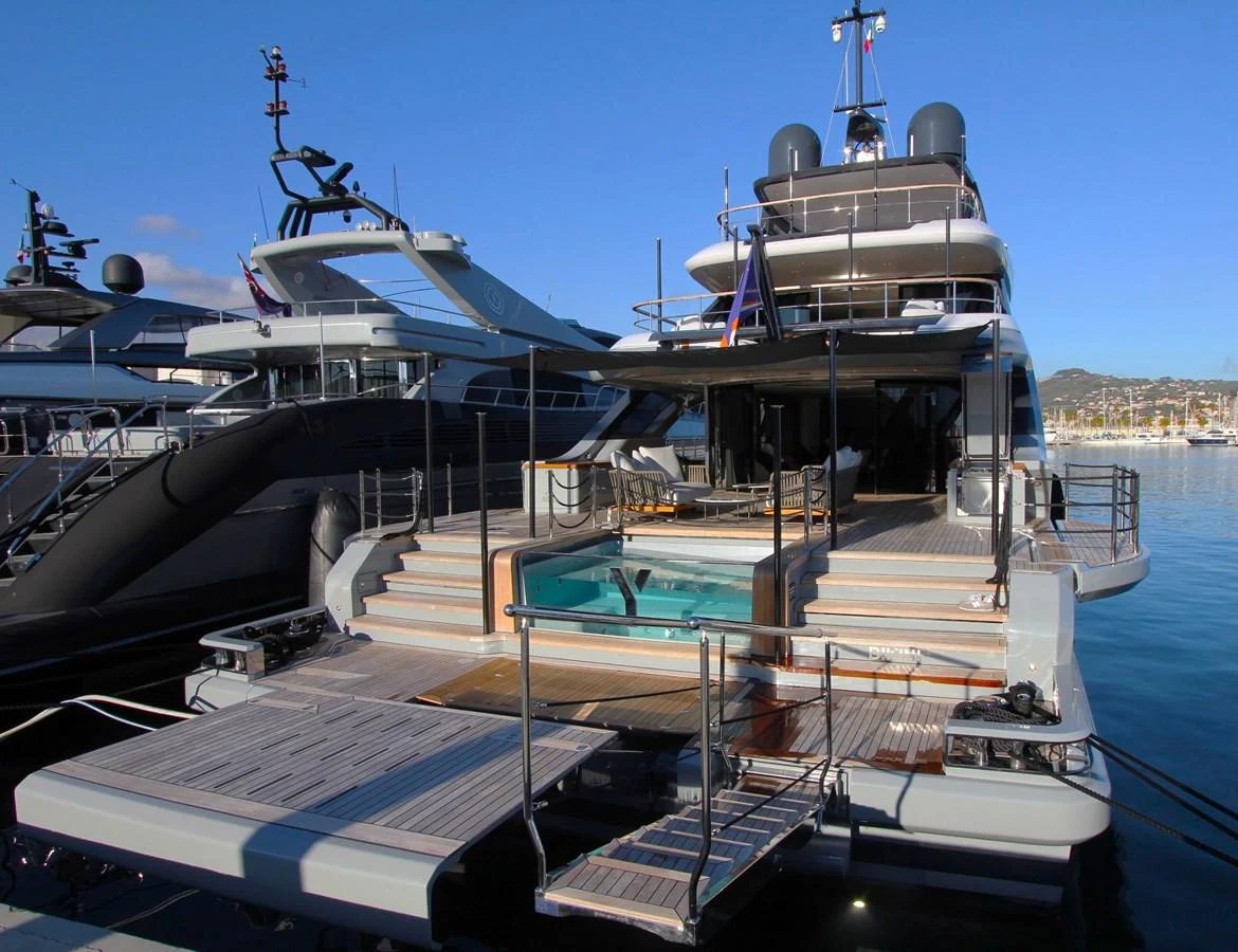 The yacht's aft deck features a luxurious pool and ample lounging space, perfect for relaxation and entertainment. aboard OASIS 34M BO212 Yacht for Sale