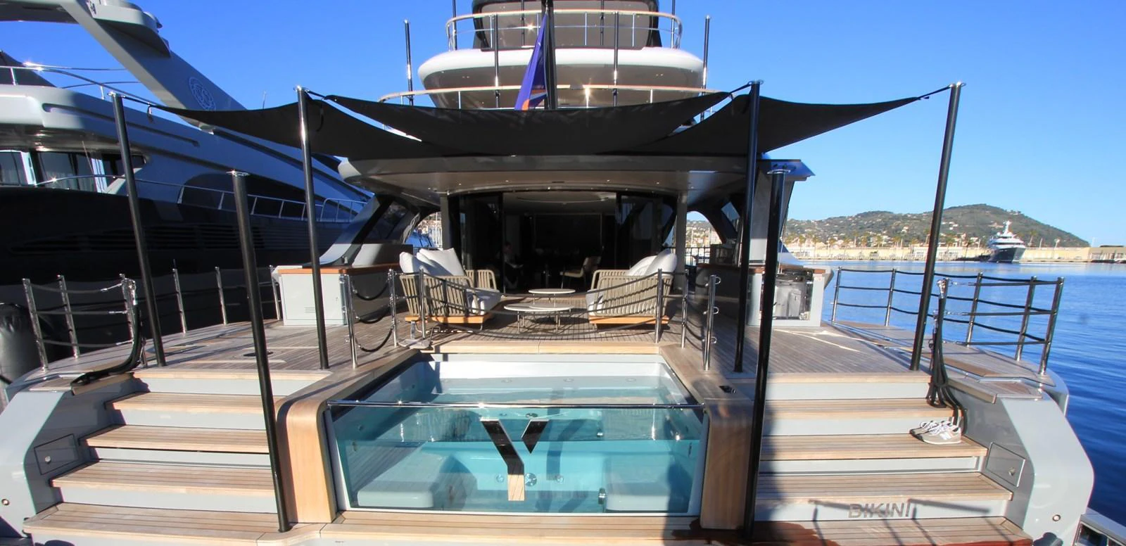 The aft deck features a luxurious pool and ample lounging space, perfect for relaxation. aboard OASIS 34M BO212 Yacht for Sale