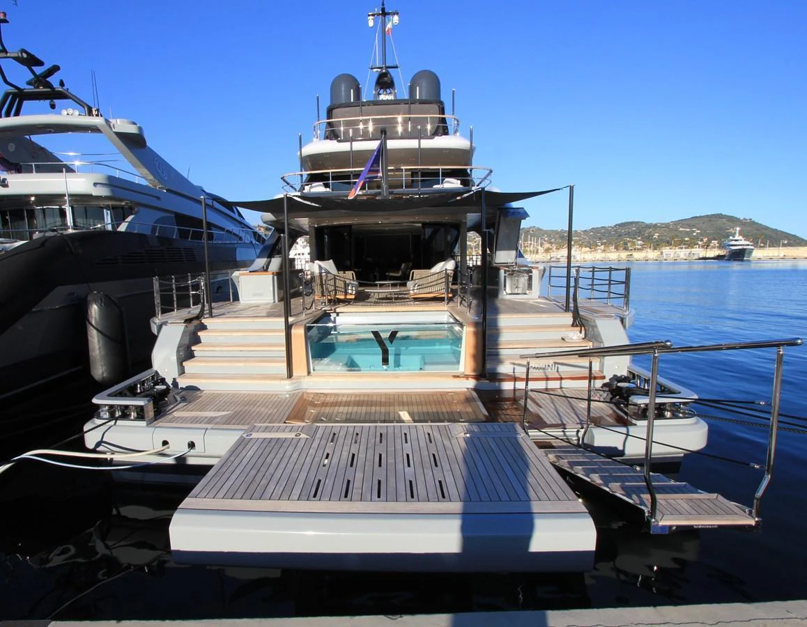 The yacht's aft deck features a luxurious pool and ample lounging space, perfect for relaxation and entertainment. aboard OASIS 34M BO212 Yacht for Sale