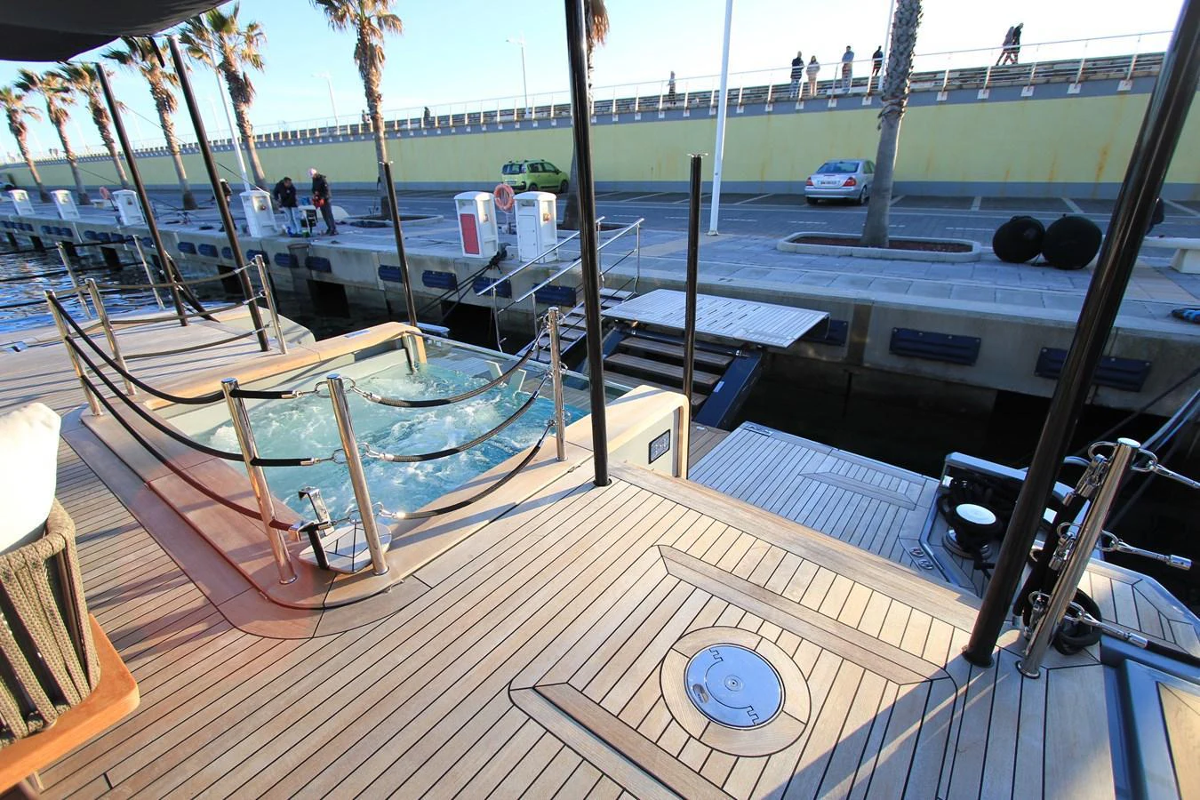 The aft deck features a luxurious jacuzzi with ample space for relaxation. aboard OASIS 34M BO212 Yacht for Sale