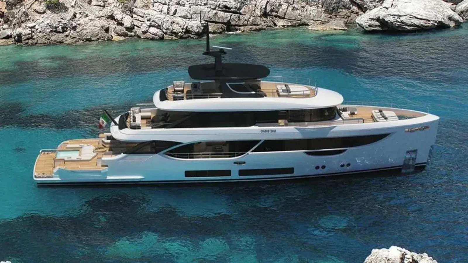 A sleek and modern yacht cruising along a rocky coastline in crystal-clear waters. aboard OASIS 34M BO212 Yacht for Sale