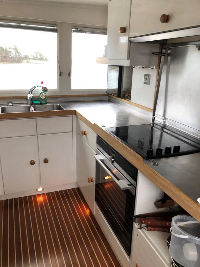 The yacht's galley features modern appliances and a sleek design with ample natural light. aboard UNITED SPIRIT Yacht for Sale