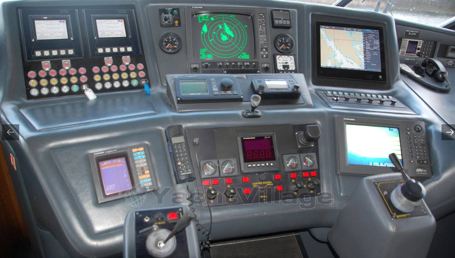 The helm station is equipped with advanced navigation and communication instruments for precise control. aboard UNITED SPIRIT Yacht for Sale