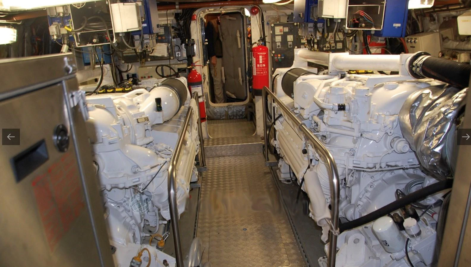 The engine room showcases powerful machinery and a well-organized layout. aboard UNITED SPIRIT Yacht for Sale