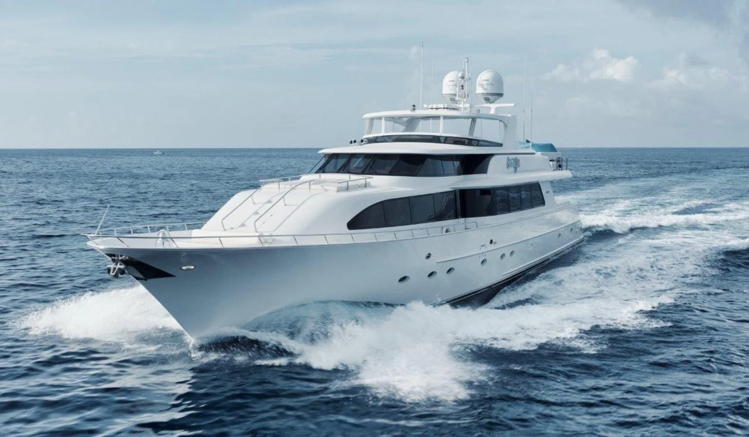 A sleek and modern yacht cruising through the open sea. aboard ISLAND GIRL Yacht for Sale