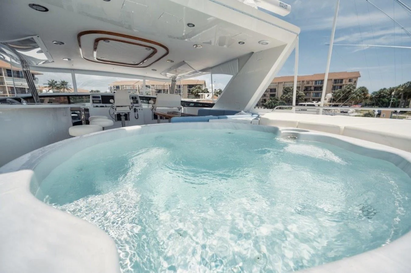 The yacht features a luxurious jacuzzi on the deck, perfect for relaxation and enjoying the view. aboard ISLAND GIRL Yacht for Sale