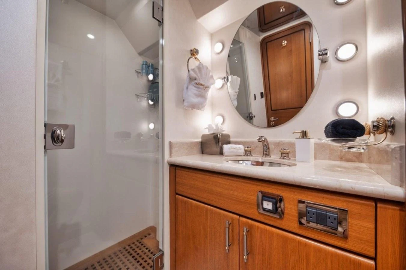 The yacht's bathroom features a sleek design with a spacious shower and elegant fixtures. aboard ISLAND GIRL Yacht for Sale