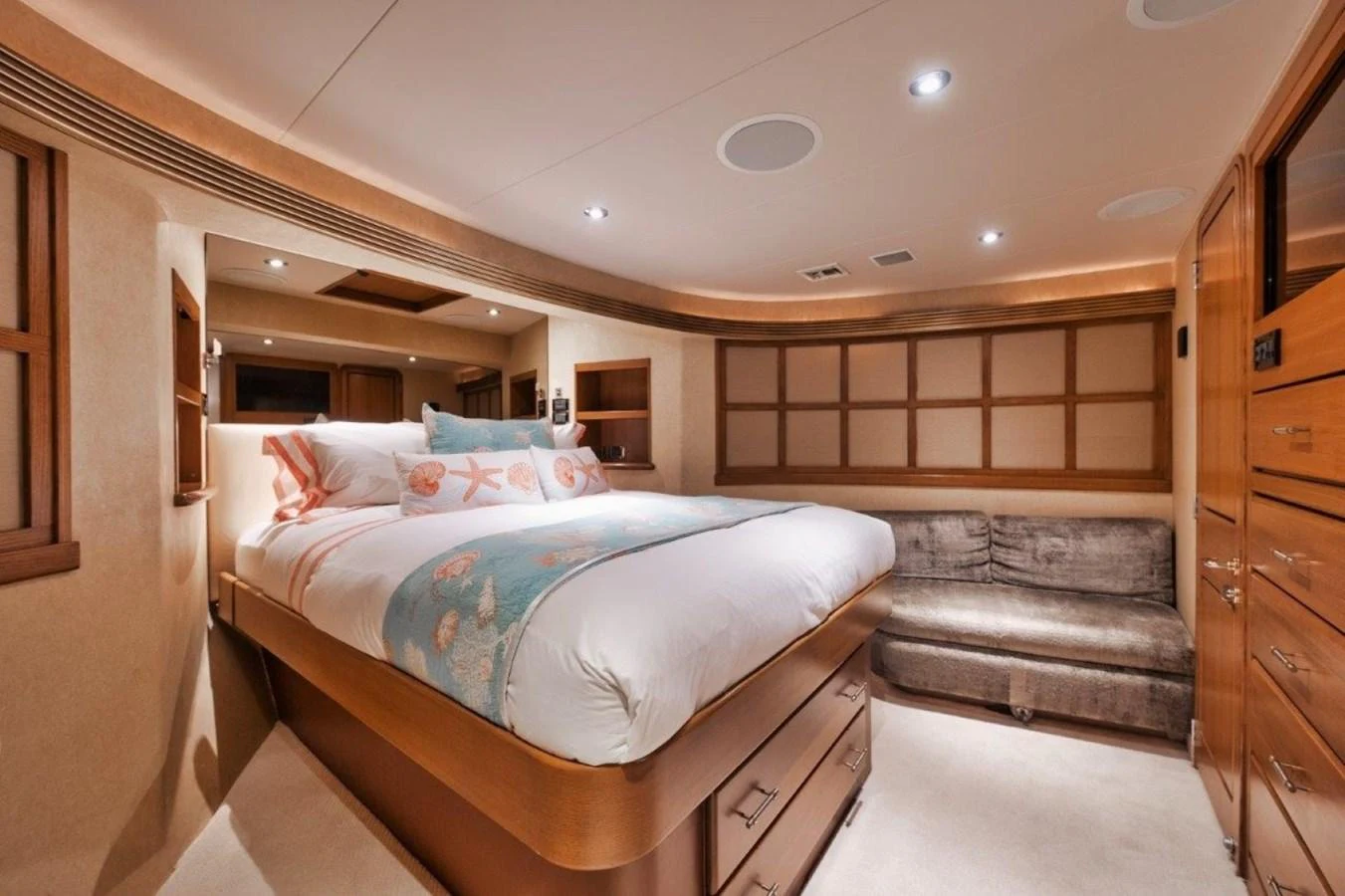The stateroom features a plush bed with elegant bedding and ample storage, creating a cozy and luxurious retreat. aboard ISLAND GIRL Yacht for Sale