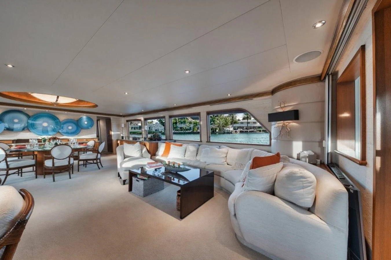The salon offers a spacious and elegant living area with ample seating and large windows for natural light and scenic views. aboard ISLAND GIRL Yacht for Sale