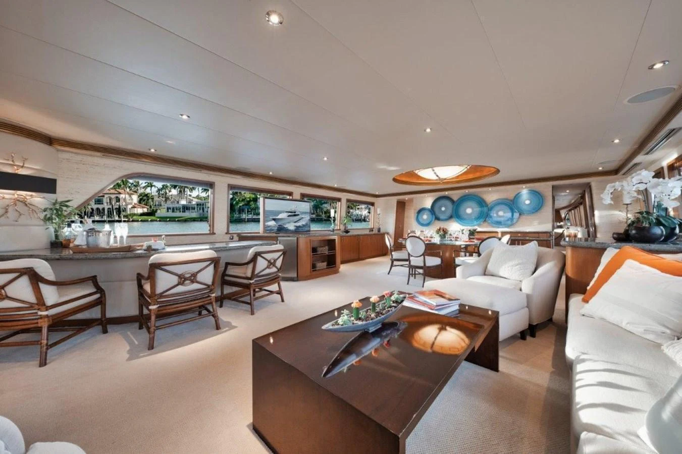 The salon offers a spacious and elegant living area with ample seating and large windows for natural light. aboard ISLAND GIRL Yacht for Sale