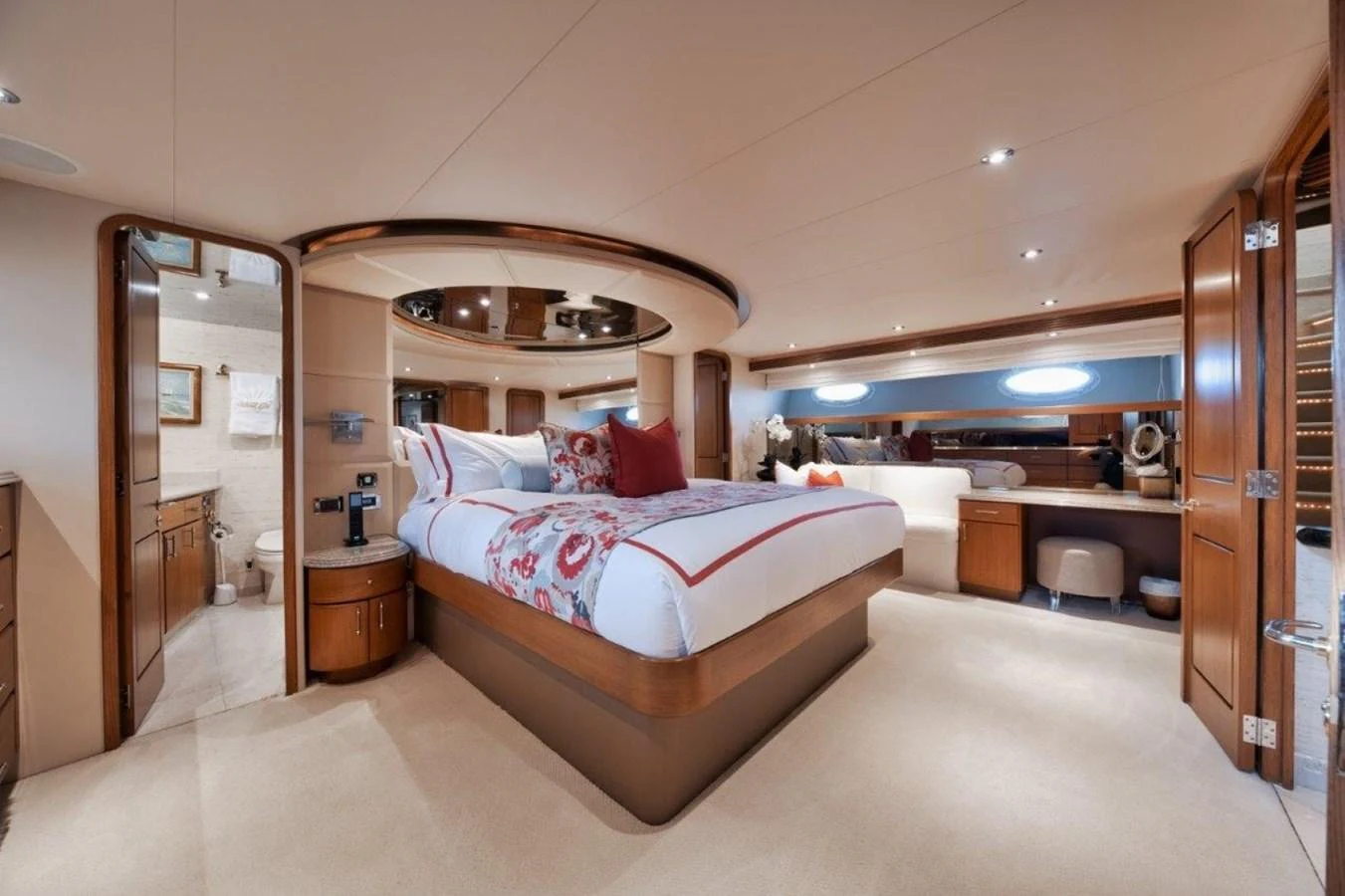 The master stateroom features a luxurious bed with elegant decor and ample natural light. aboard ISLAND GIRL Yacht for Sale