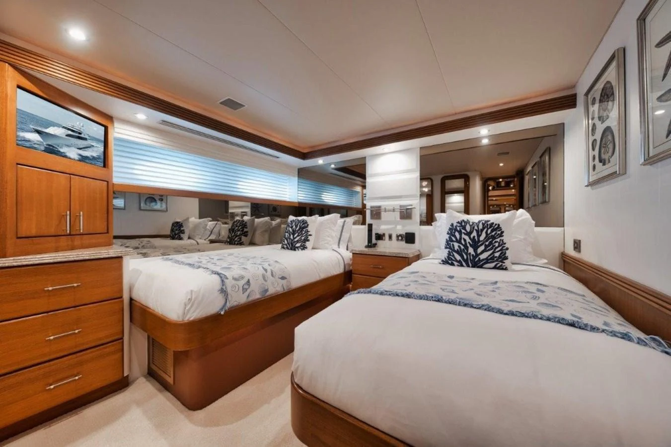 The guest stateroom features twin beds with elegant bedding and ample storage. aboard ISLAND GIRL Yacht for Sale