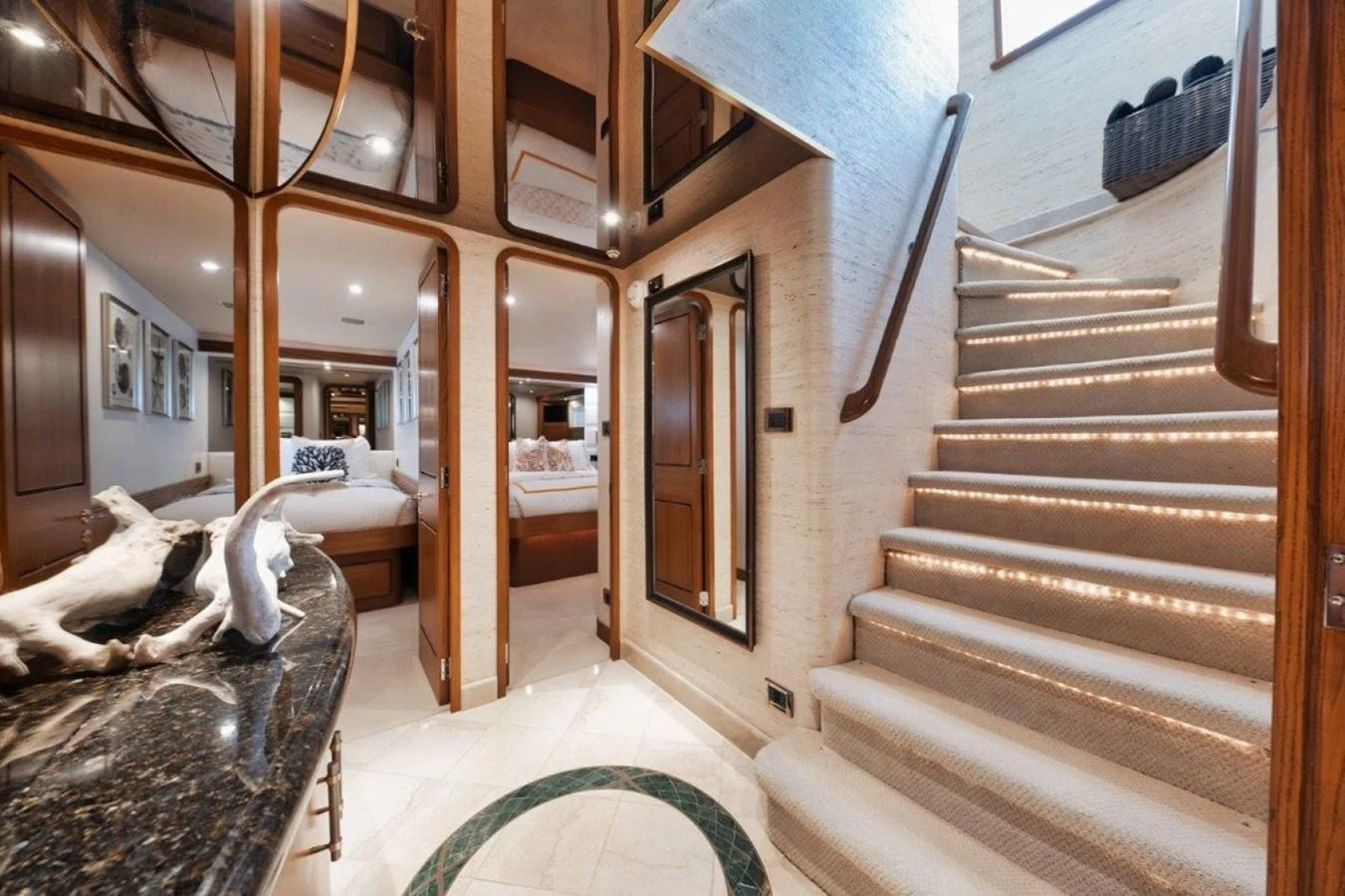 A luxurious yacht interior featuring a beautifully lit staircase and elegant decor. aboard ISLAND GIRL Yacht for Sale