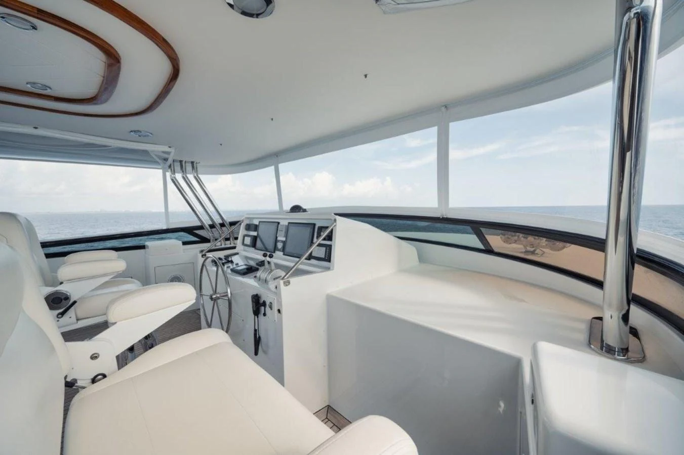 The helm station offers a sleek and modern design with panoramic views of the ocean. aboard ISLAND GIRL Yacht for Sale