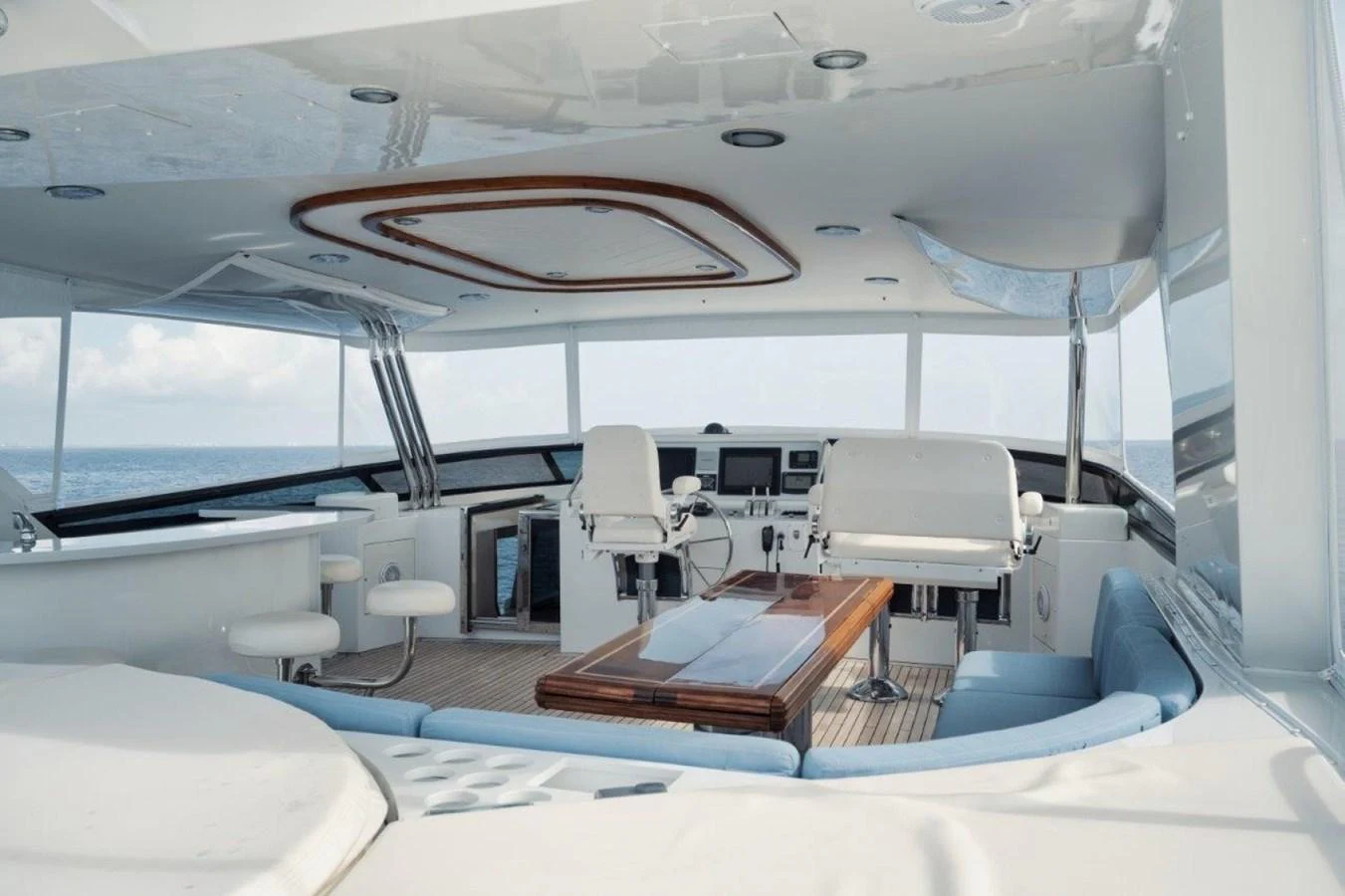 The helm area features a spacious and modern design with comfortable seating and advanced navigation equipment. aboard ISLAND GIRL Yacht for Sale