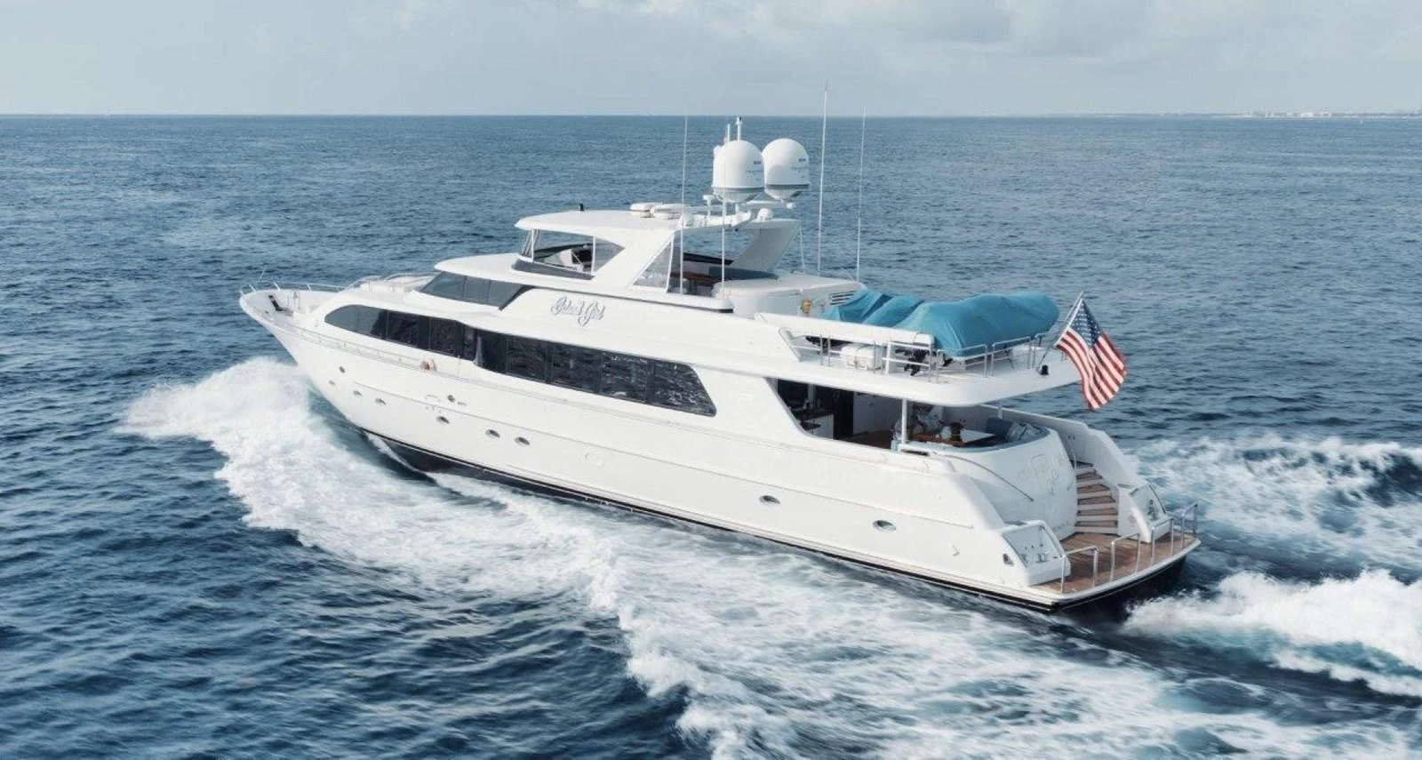 A sleek and elegant yacht cruising through the open sea, showcasing its luxurious design and spacious decks. aboard ISLAND GIRL Yacht for Sale