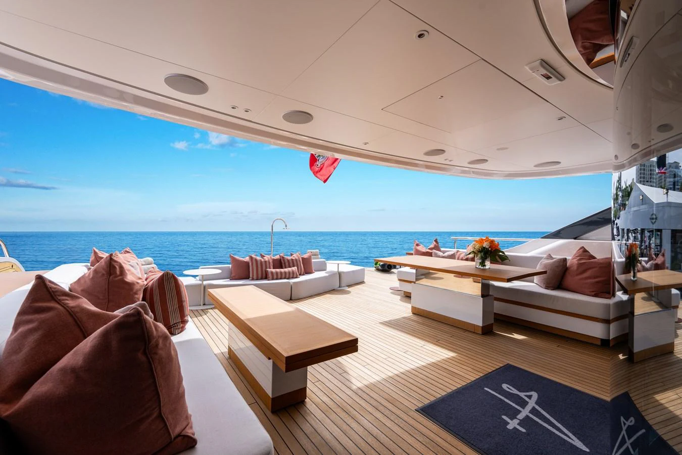 The spacious aft deck offers luxurious seating with stunning ocean views. aboard A+ Yacht for Sale
