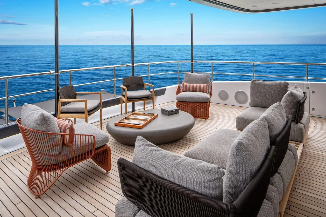 The aft deck offers a luxurious outdoor seating area with stunning ocean views. aboard A+ Yacht for Sale