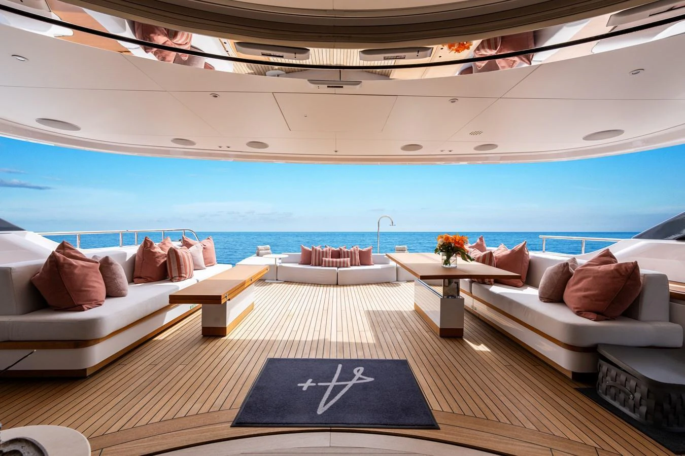 The aft deck features luxurious seating with a stunning ocean view. aboard A+ Yacht for Sale