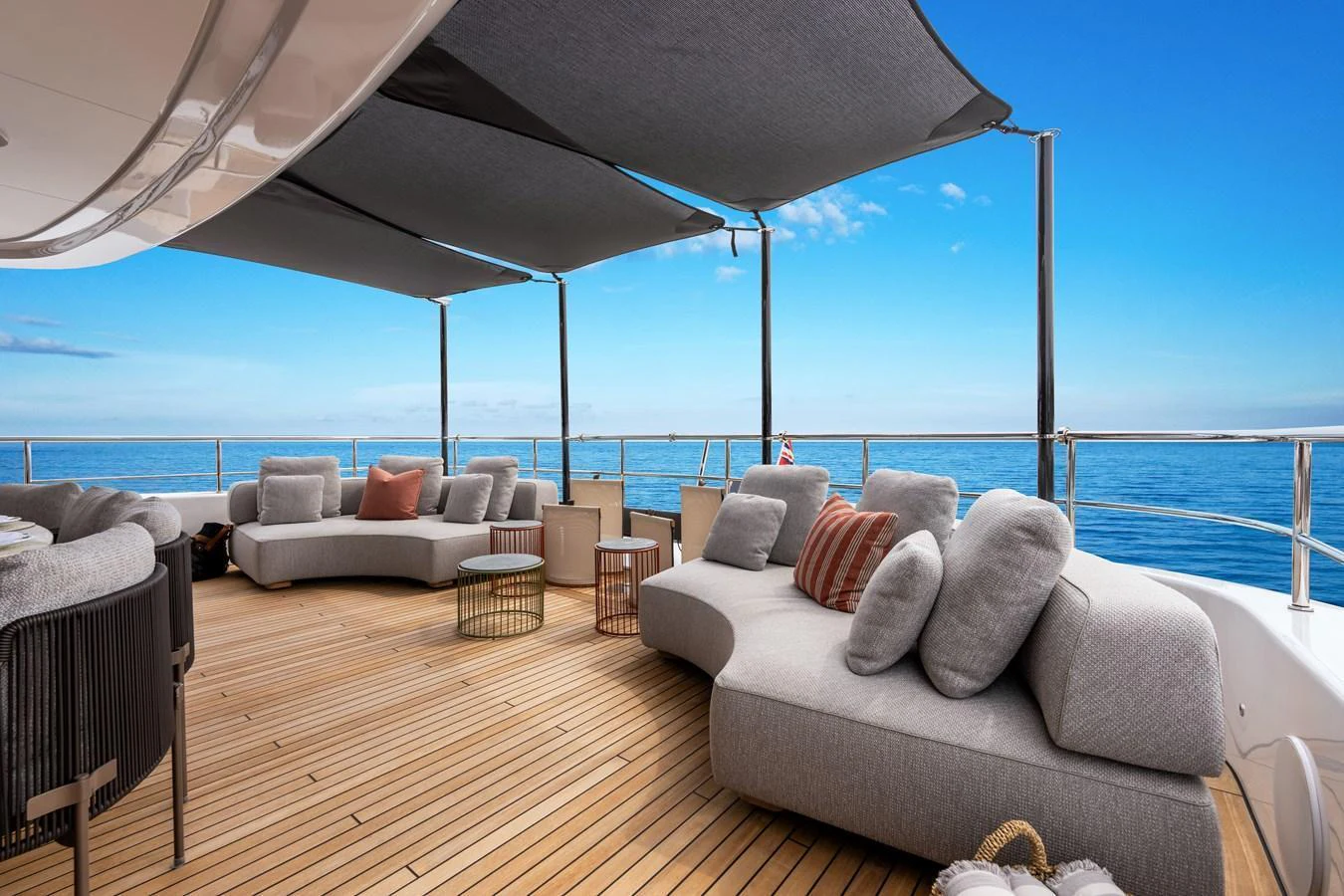 The sundeck offers a luxurious lounging area with comfortable seating and stunning ocean views. aboard A+ Yacht for Sale