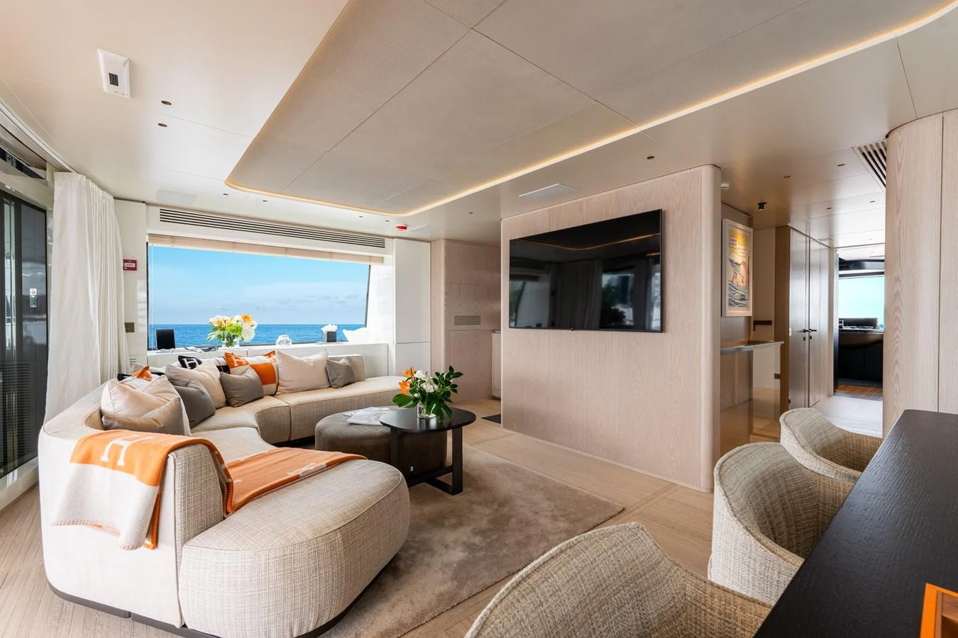 The salon features a spacious and elegantly designed seating area with panoramic ocean views. aboard A+ Yacht for Sale