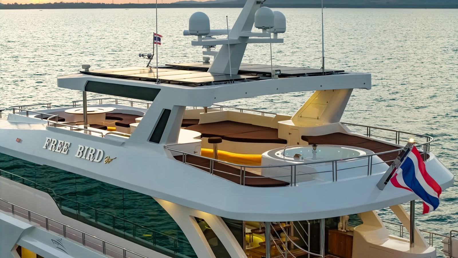 The yacht's upper deck features a luxurious hot tub and ample lounging space, perfect for relaxation. aboard FREE BIRD Yacht for Sale