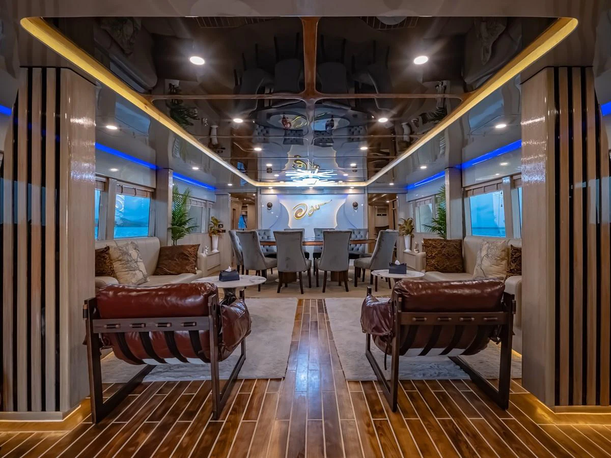 The luxurious salon features elegant seating and sophisticated decor, perfect for relaxation and socializing. aboard FREE BIRD Yacht for Sale