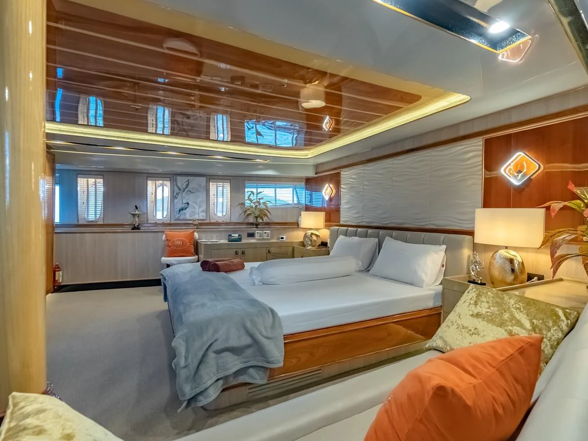 The master stateroom offers a spacious and luxurious retreat with elegant decor and ample natural light. aboard FREE BIRD Yacht for Sale