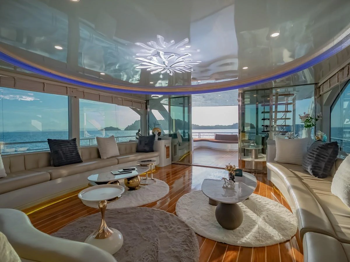 The salon offers a luxurious and spacious area with panoramic views of the sea. aboard FREE BIRD Yacht for Sale