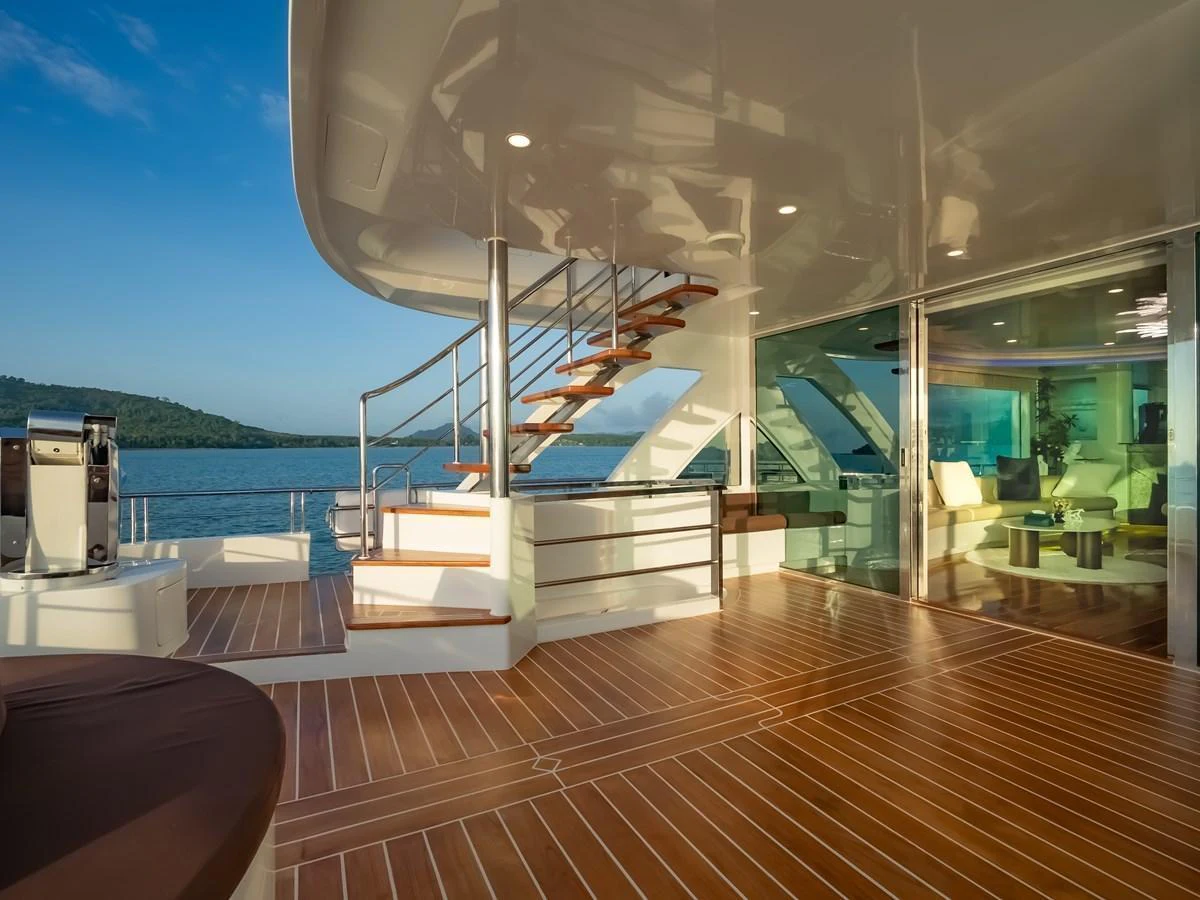 The aft deck offers a spacious and elegant area for relaxation with stunning views of the surrounding waters. aboard FREE BIRD Yacht for Sale