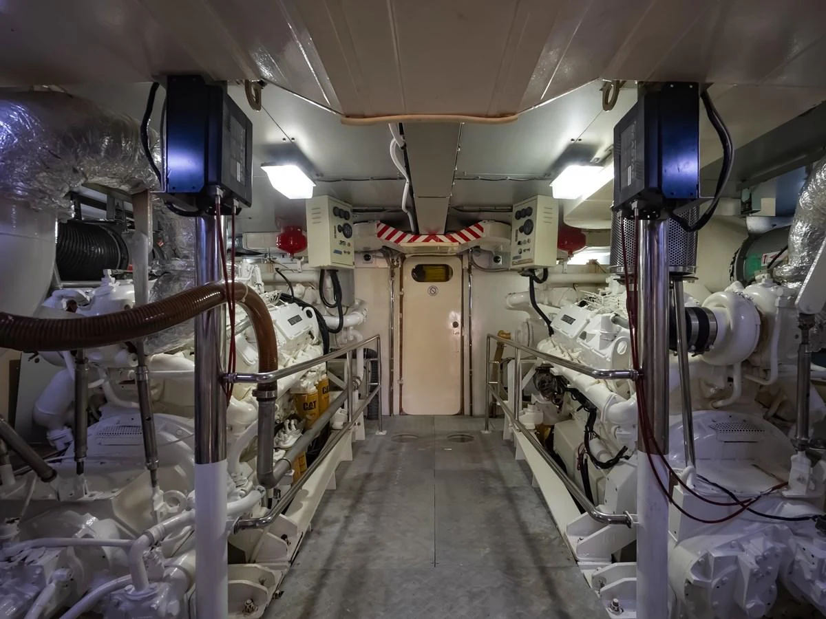 The engine room showcases a well-organized and meticulously maintained space with advanced machinery. aboard FREE BIRD Yacht for Sale