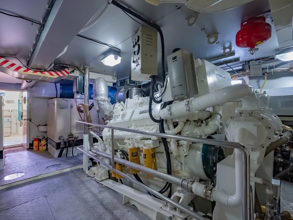 The image showcases a well-maintained engine room with advanced machinery and equipment. aboard FREE BIRD Yacht for Sale