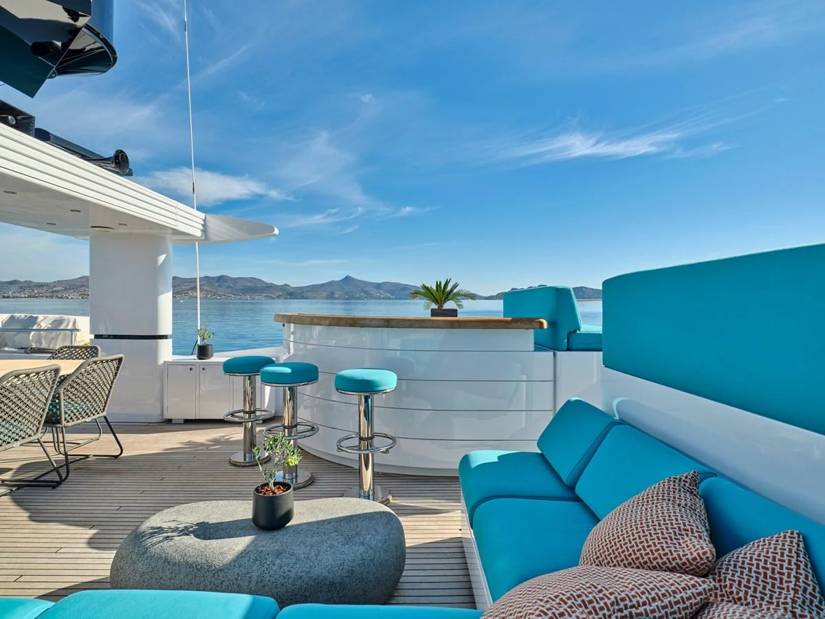 The sundeck offers a luxurious outdoor seating area with stunning views of the water. aboard VENETICO Yacht for Sale