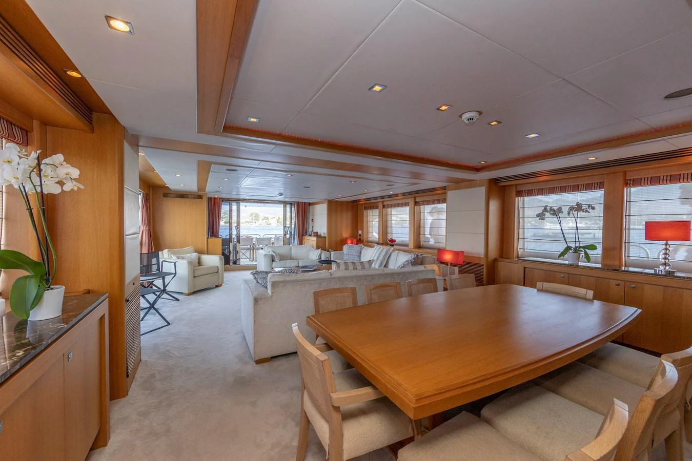 The yacht's salon features a spacious and elegantly designed seating area with ample natural light. aboard FINAL CUT Yacht for Sale