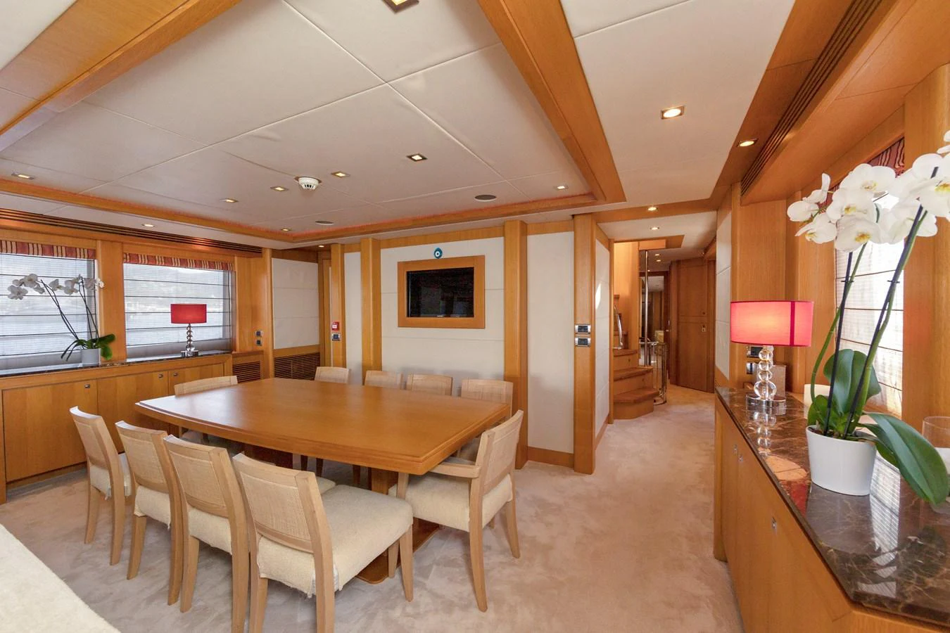 The yacht's dining area features a spacious table with comfortable seating and elegant decor. aboard FINAL CUT Yacht for Sale