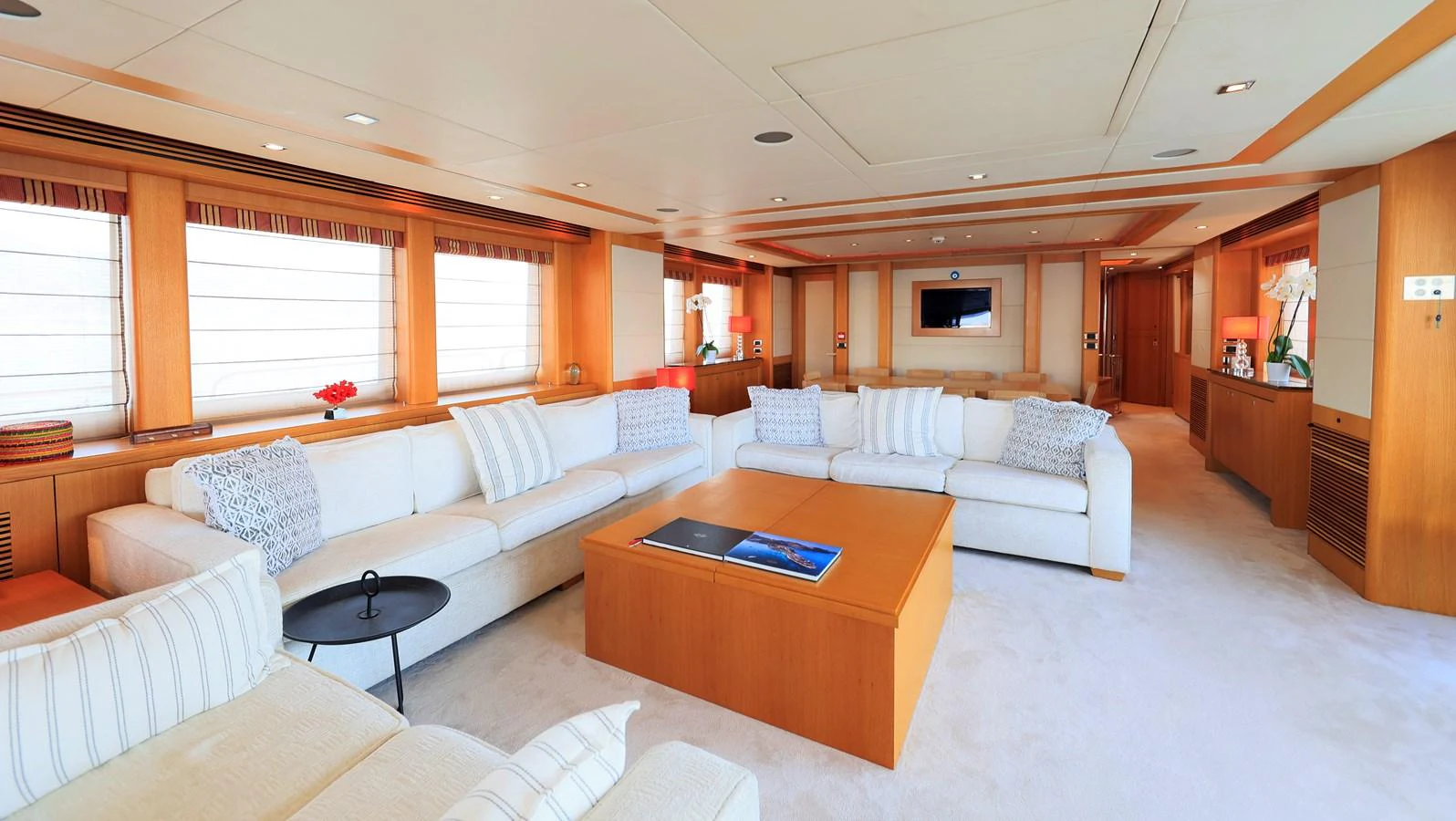 The spacious salon features plush seating and elegant decor, perfect for relaxation and entertainment. aboard FINAL CUT Yacht for Sale