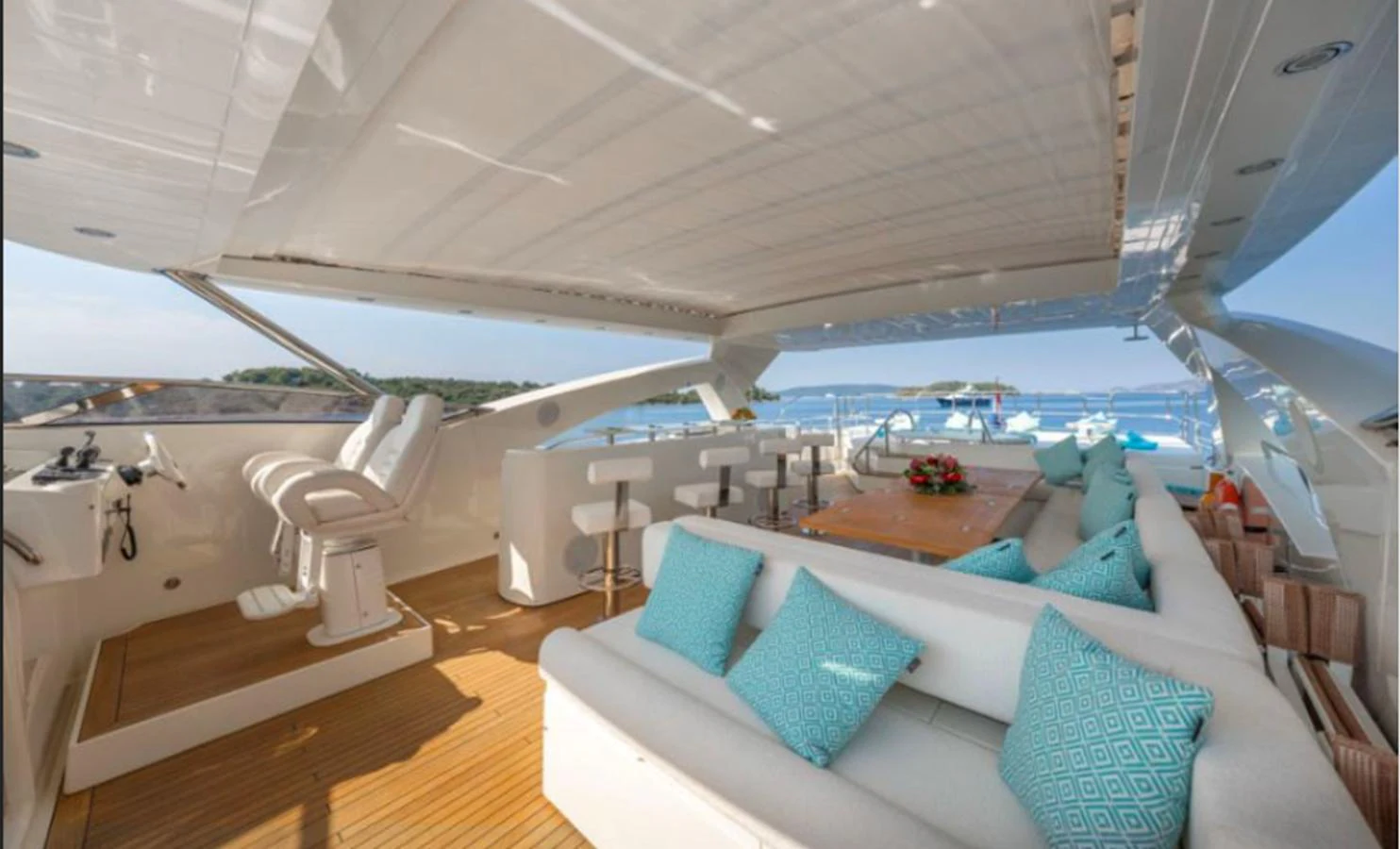 The flybridge offers a spacious and luxurious area for relaxation and dining with stunning views. aboard ARAGO Yacht for Sale