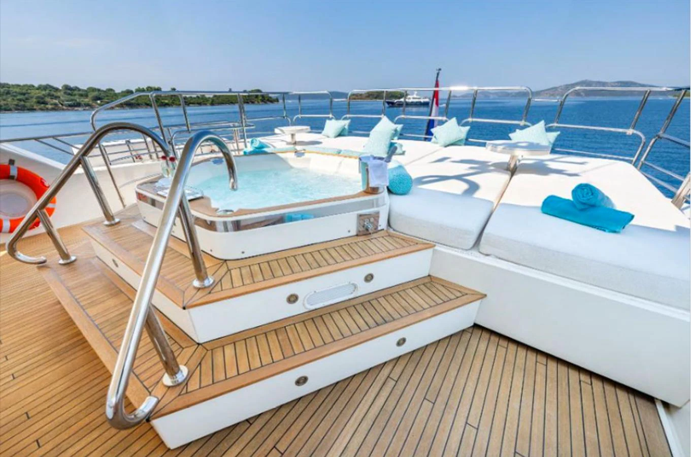 The sundeck features a luxurious jacuzzi and comfortable sun loungers with stunning sea views. aboard ARAGO Yacht for Sale