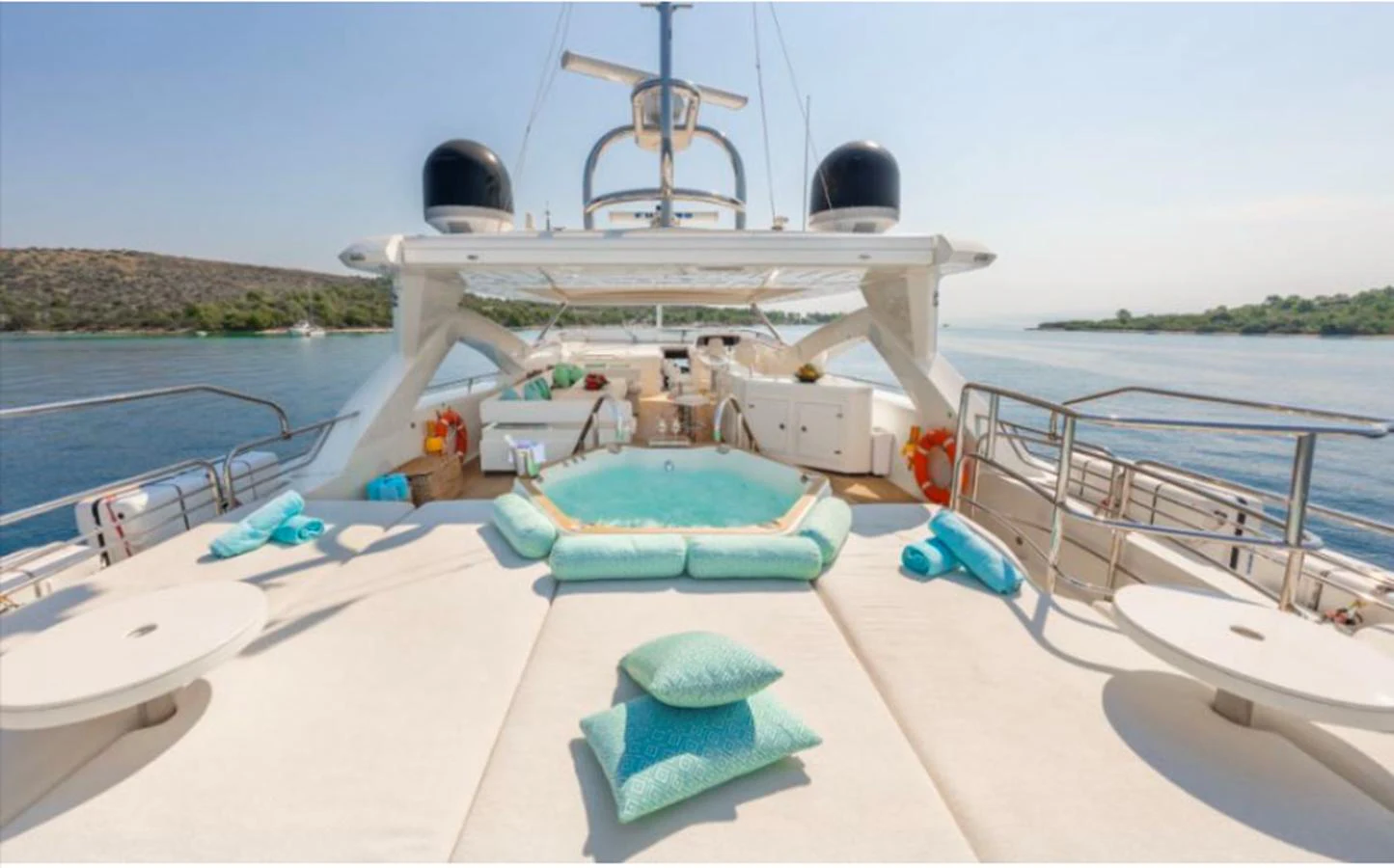 The sundeck features a luxurious jacuzzi surrounded by plush seating and scenic views. aboard ARAGO Yacht for Sale