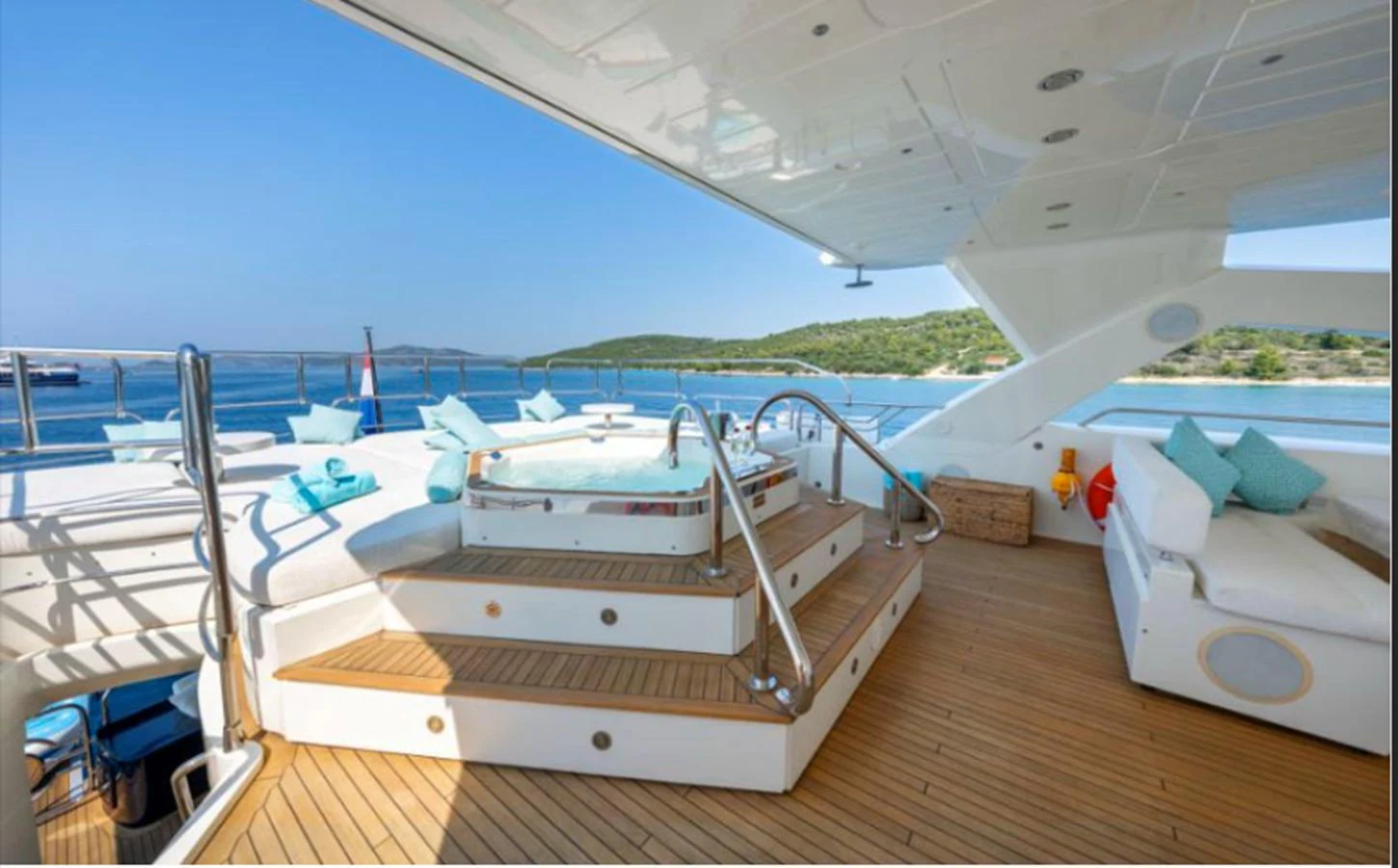 The sundeck features a luxurious jacuzzi with comfortable seating and stunning views of the surrounding waters. aboard ARAGO Yacht for Sale
