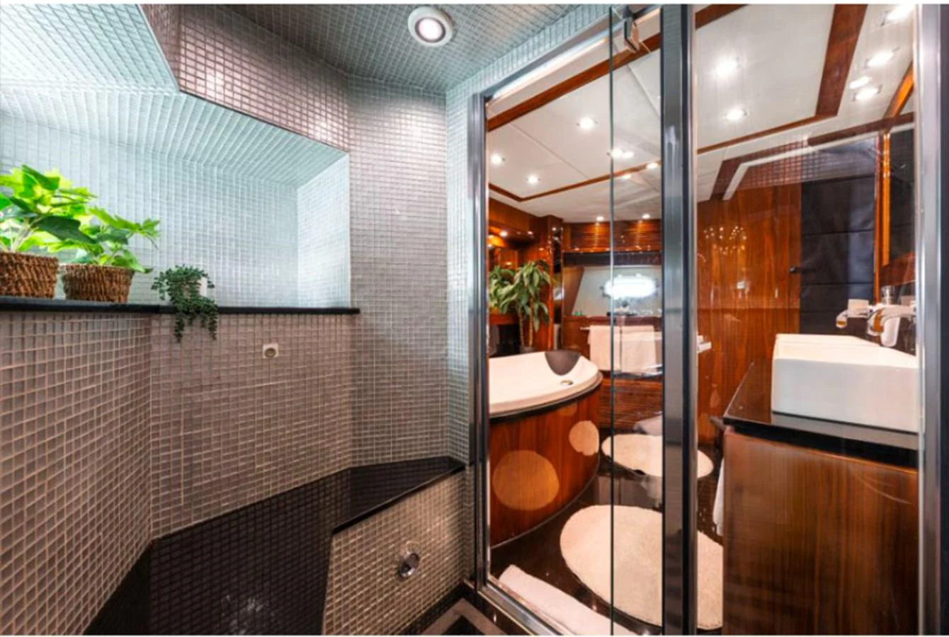 The yacht's bathroom features a luxurious design with modern fixtures and elegant finishes. aboard ARAGO Yacht for Sale