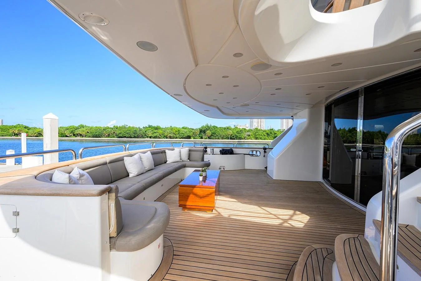 The aft deck features a spacious seating area with a sleek, modern design and stunning views. aboard BENETTI CLASSIC Yacht for Sale