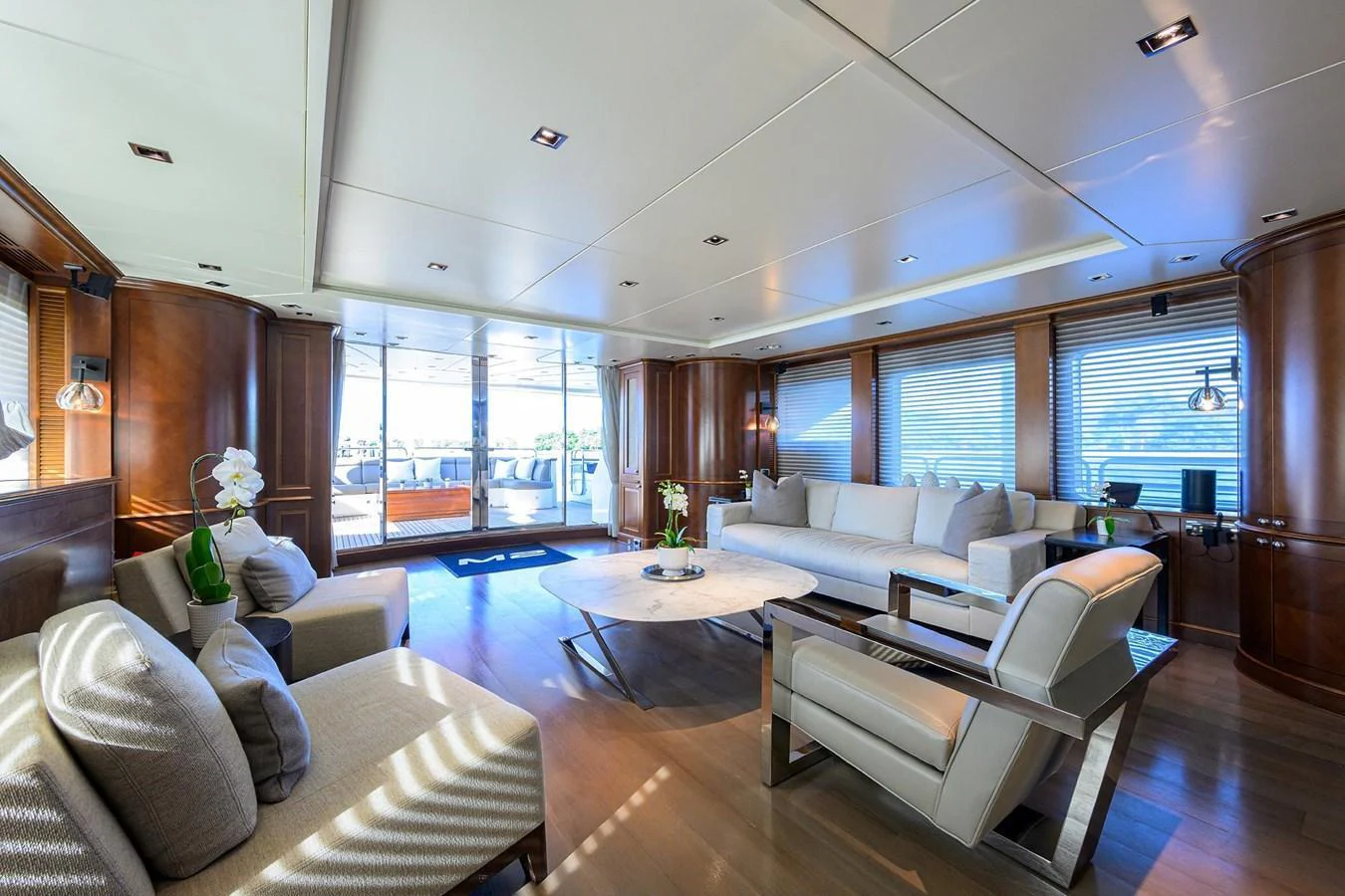 The spacious salon features elegant furnishings and ample natural light. aboard BENETTI CLASSIC Yacht for Sale