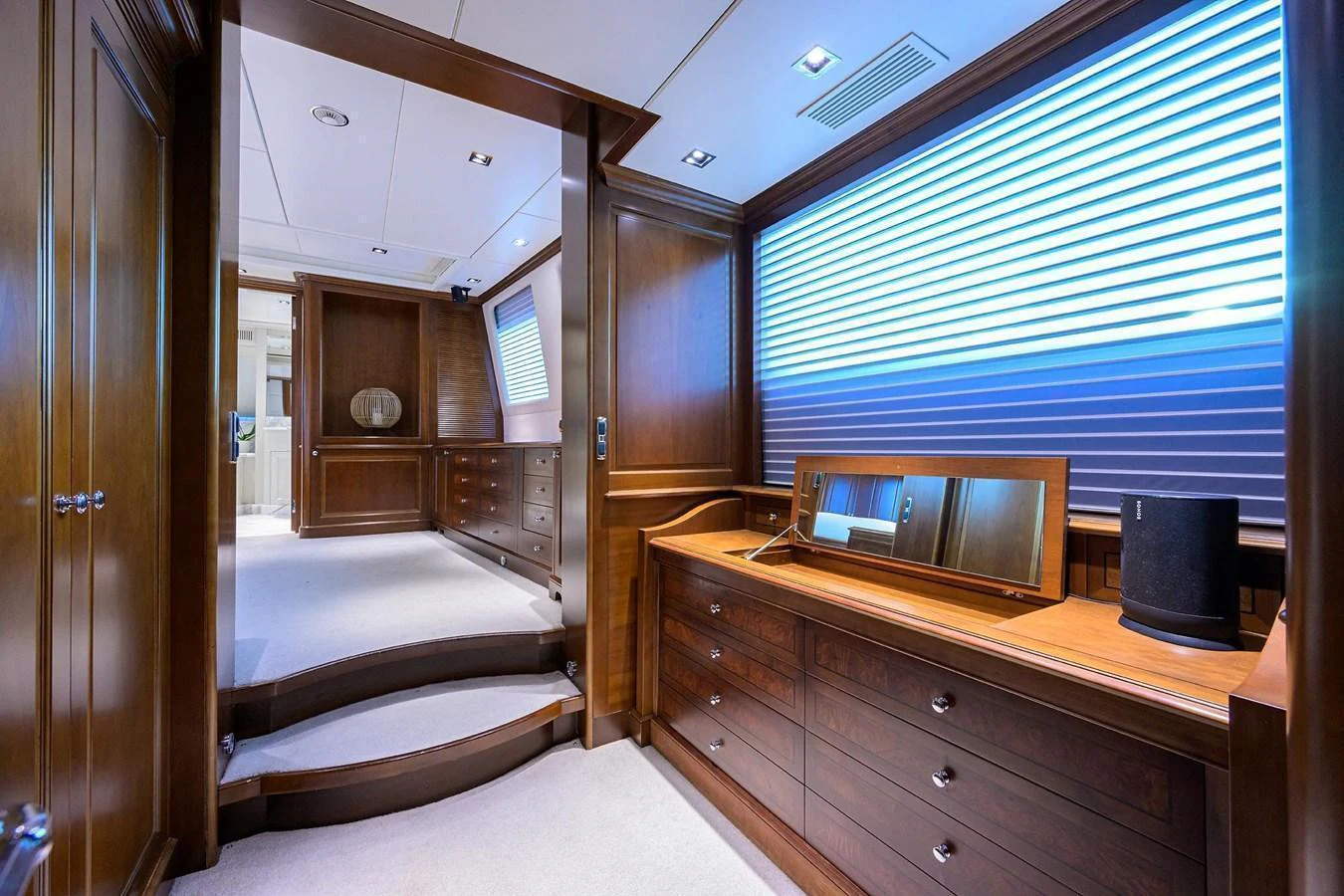 A luxurious yacht hallway featuring elegant wooden cabinetry and modern lighting. aboard BENETTI CLASSIC Yacht for Sale