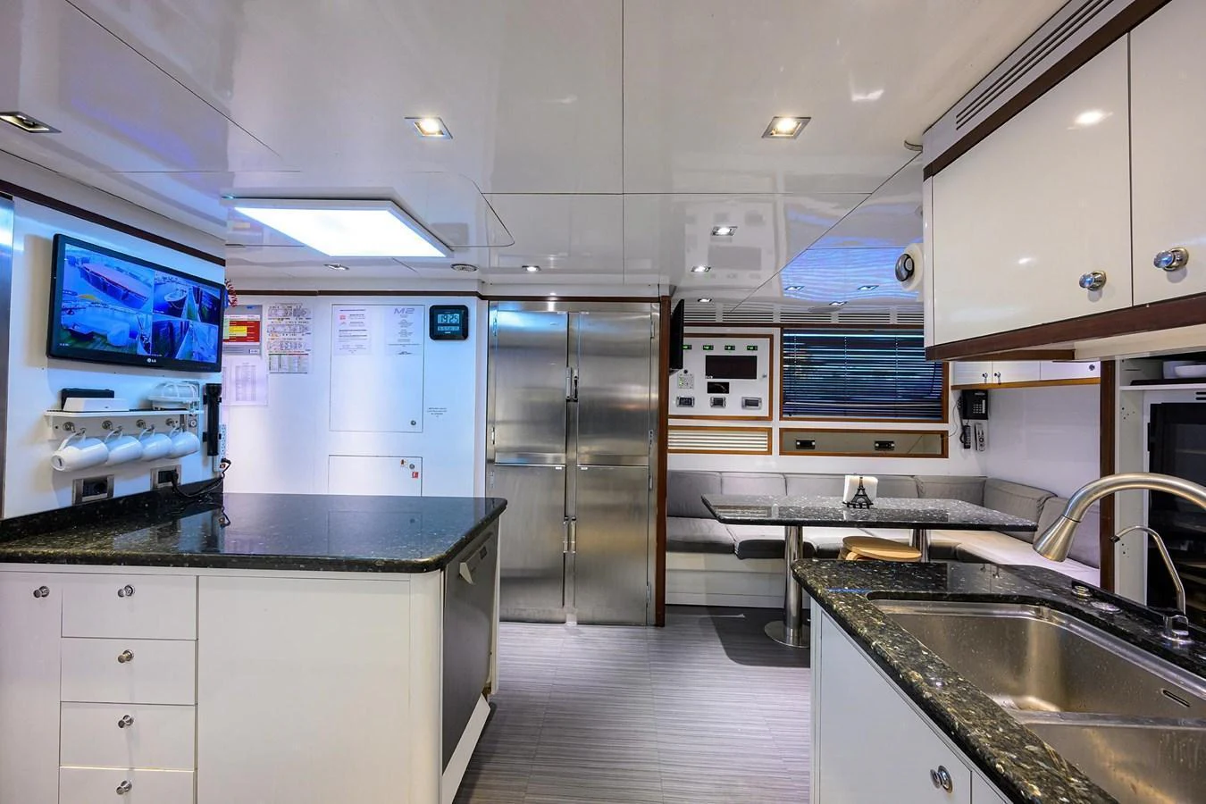 The yacht's galley is equipped with modern appliances and a comfortable dining area. aboard BENETTI CLASSIC Yacht for Sale