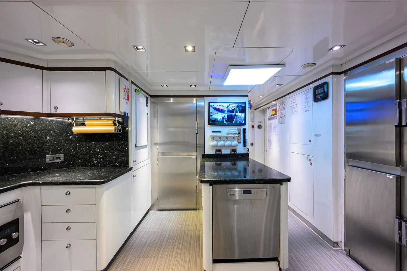 The yacht's galley is equipped with modern appliances and sleek finishes, offering a functional and stylish space for culinary activities. aboard BENETTI CLASSIC Yacht for Sale